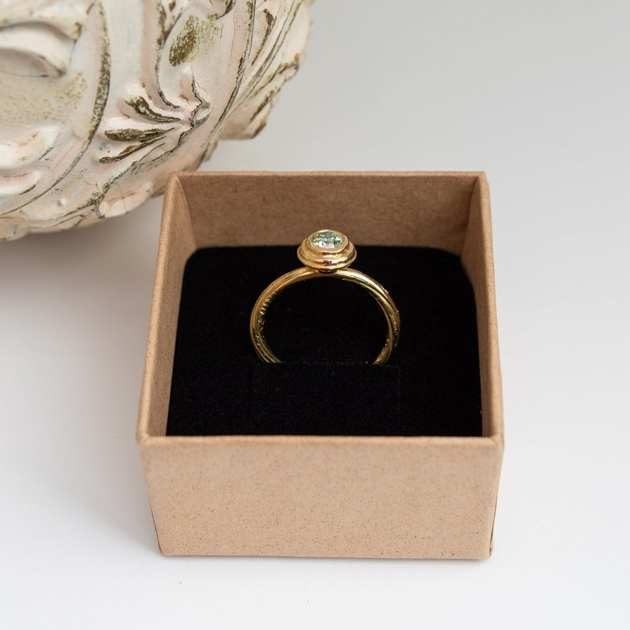 Teal Colour Moissanite Ring in 18ct Yellow Gold. Fold Twist style organic band.
