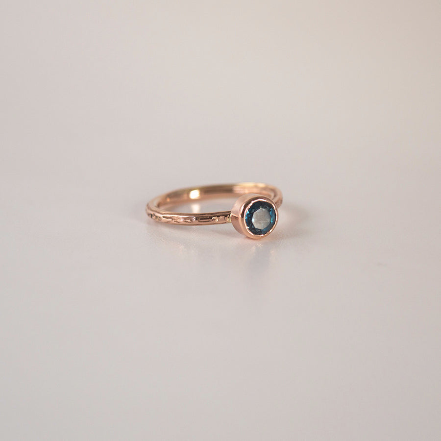 Classic twist textured Rose Gold Ring with London Blue Topaz.